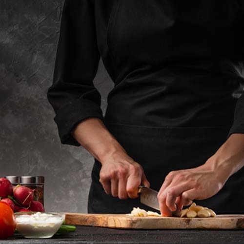 Chef chopping garlic